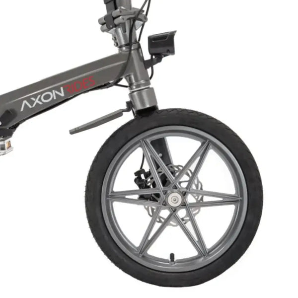 Close-up of the front wheel on the Axon Rides Pro 250W folding electric bike, showing alloy rims and disc brake.