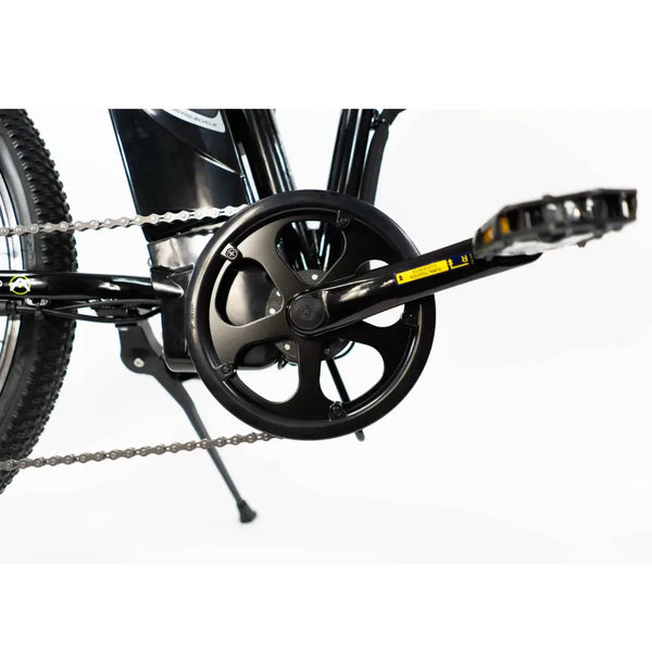 Close-up of the chainring, chain, and foldable pedals on the Basis Boxer 24-inch folding e-bike.