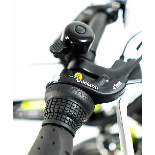 Detailed shot of the Shimano Revoshift twist grip shifter and bell on the Basis Boxer e-bike.
