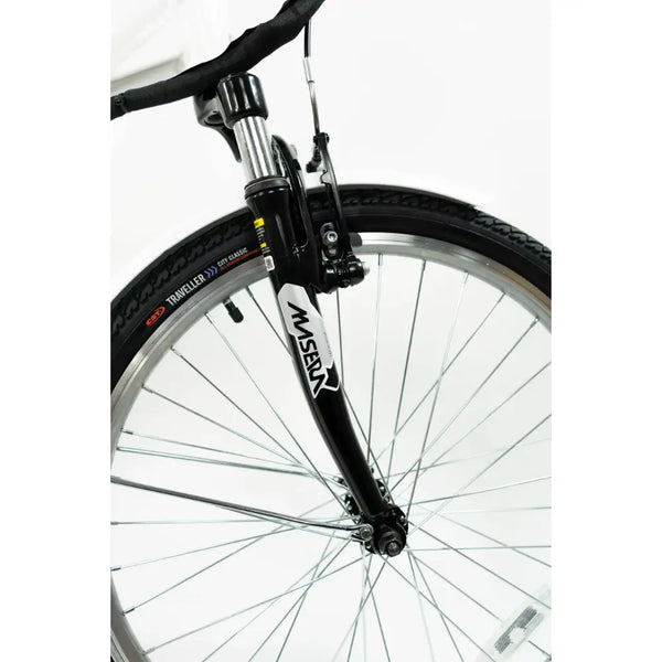 Close-up of the Masera suspension fork and front wheel on the Basis Dorchester 24-inch e-bike.