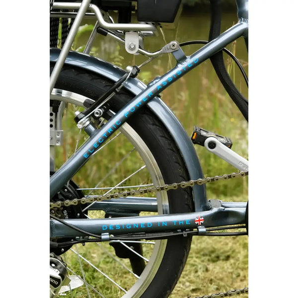 Detailed rear frame view of the Basis Osprey Electric Bike 250W showing chainstay branding and UK-designed label.