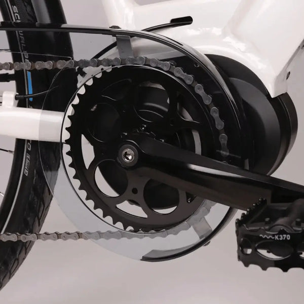 Close-up of the mid-drive motor and crankset of the Batribike Penta X electric hybrid bike, showing chain guard and pedal detail.