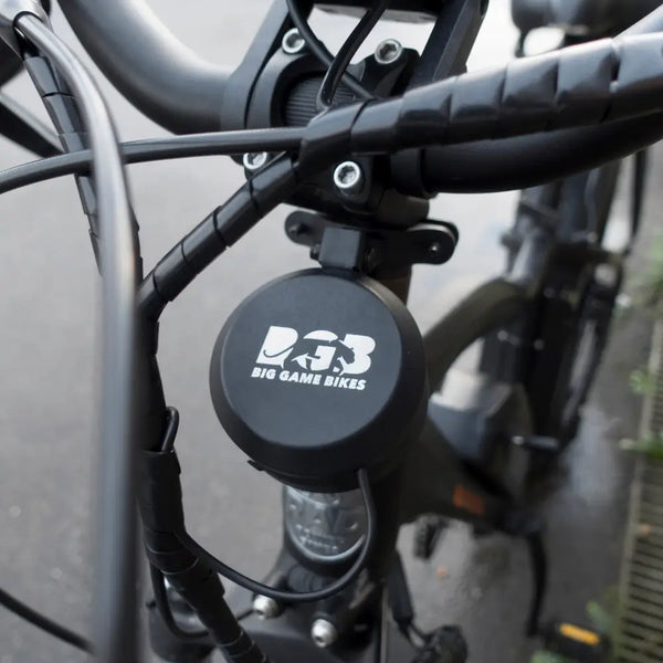 Big Game Bikes 125dB electric bike horn mounted on bicycle handlebar.