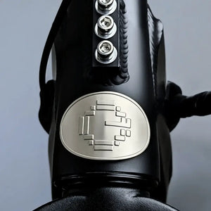 Close-up of E Movement Raven electric bike head badge