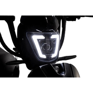 Close-up view of the Eskuta SX-250 Series 4 electric bike LED headlight with distinctive angular design.