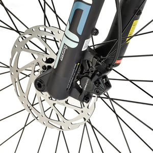 Close-up of the front disc brake with Tektro caliper and SR Suntour suspension fork on the EZEGO Trail Destroyer II e-mountain bike.