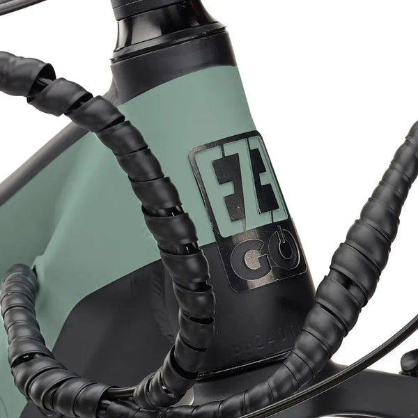 Close-up view of the EZEGO Trail Destroyer II electric mountain bike's headtube with logo and cable wrap, viewed from the left side.