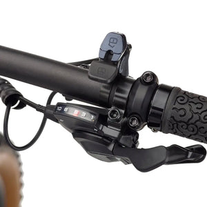 Close-up of the right handlebar gear shifter on the EZEGO Trail Destroyer II electric bike, showing numbered gear display and textured grip.