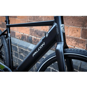 Detailed view of the Falcon Zone Single Speed electric hybrid bike frame with integrated battery and Falcon branding.