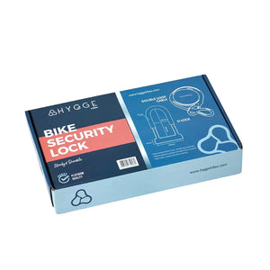 Packaging of the Hygge D-Lock with Cable, featuring product specifications, illustrations, and branding on a blue retail box.