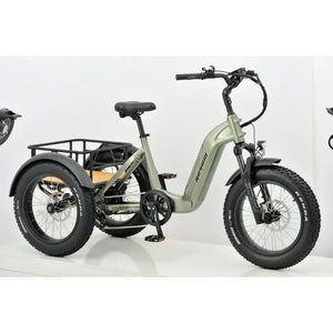 Side view of the green Revom electric bike with step-through frame, wide tyres, and a spacious rear cargo rack for stable utility riding.