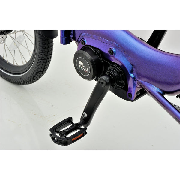 Close-up of the Revom T4 semi-recumbent electric tricycle showing the mid-drive motor and crank arm.