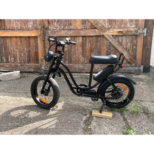 Rocket ST step-through electric bike with fat tyres and rear hub motor parked outdoors