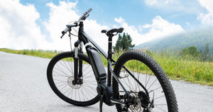 Electric bike parked on a quiet countryside road, highlighting the practicality and value of modern e-bikes for everyday riding and scenic outdoor journeys.