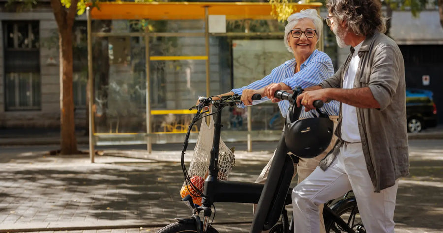 Senior couple riding step-through electric bikes, a joint-friendly option for bad knees and arthritis