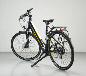 Step-through electric bike with rear rack and upright frame designed for easy mounting and commuting