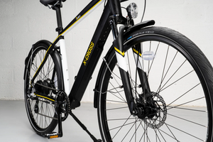 Hybrid electric bike with front suspension and disc brakes designed for commuting and mixed terrain