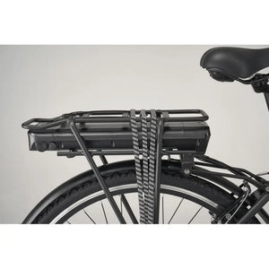 Electric bike rear rack battery with securing straps mounted on a commuter e-bike