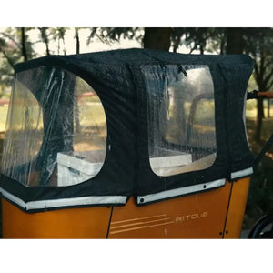 Close-up of the protective rain cover installed on the Aitour Family C cargo box, showcasing clear windows and weather-resistant fabric for all-weather family cycling.