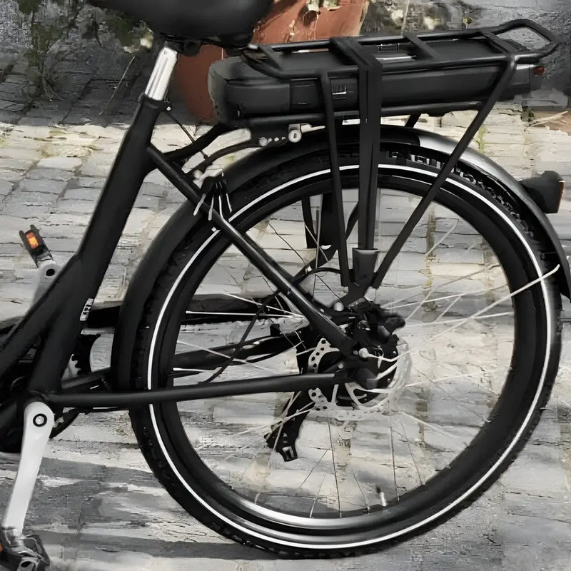 Detail shot of the rear wheel hub motor and battery mounted under the rear cargo rack.