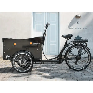 Side profile of the black Amcargobikes Curve cargo trike showing the spacious wooden box and ergonomic handlebars.