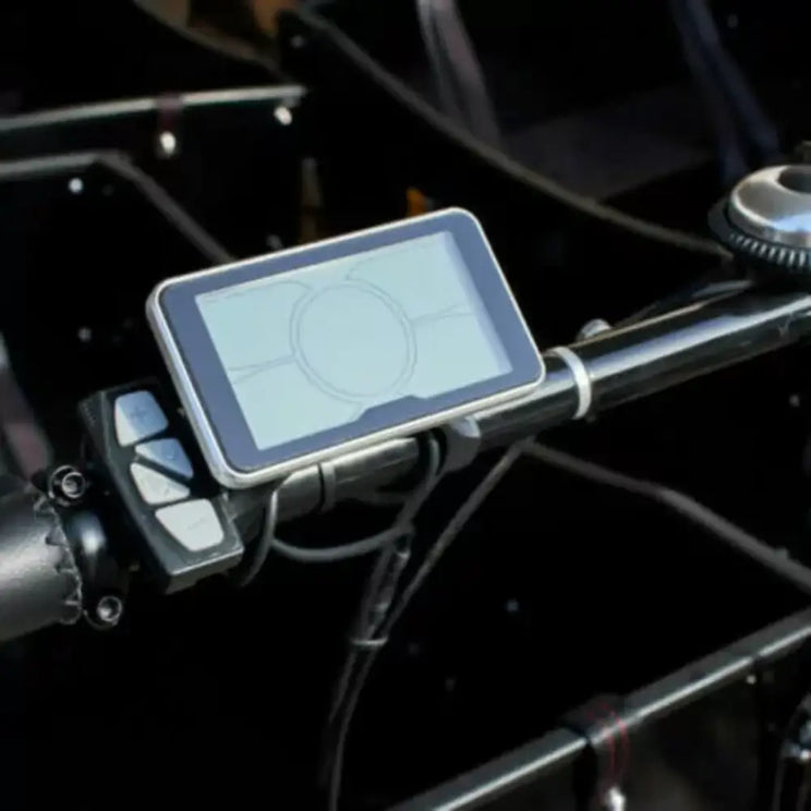 Close-up of the handlebar-mounted LCD control panel on the Amcargobikes Workman electric cargo bike.