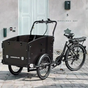 Front-right view of the black Amcargobikes Ultimate Curve electric cargo bike, designed for safe family transport.