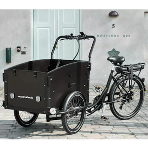Front-right view of the black Amcargobikes Ultimate Curve electric cargo bike, designed for safe family transport.