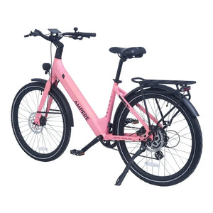 Ampere Deluxe pink step-through electric bike from a rear three-quarter angle with kickstand deployed.