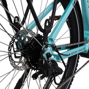 Detail of the rear frame triangle showing the disc brake rotor and Devon England branding on the Ampere Deluxe Pro.