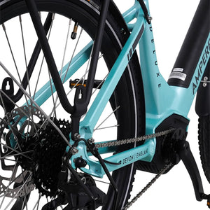 Detail of the rear frame triangle showing the disc brake rotor and Devon England branding on the Ampere Deluxe Pro.