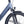 Close-up of the Ampere Deluxe Pro stone blue front fork suspension and integrated LED headlight.