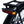 Close-up of the Ampere Deluxe integrated rear light unit on black pannier rack showing red and amber LEDs.