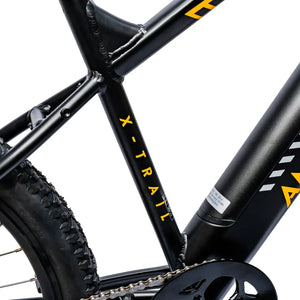 Close-up of the black and yellow Ampere logo branding on the black downtube of the X-Trail.