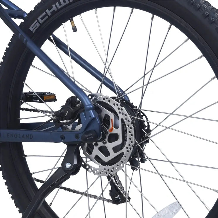 Close-up of the Ampere X-Trail stone blue rear wheel hub with hydraulic disc brake rotor.