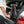 Woman loading the folded Axon Rides Pro Lightweight Folding Electric Bike 250W into the boot of a car, showcasing portability.