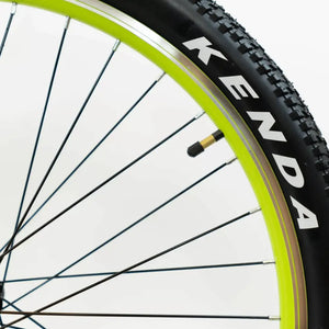 Detailed view of the Kenda tyre and neon-accented rim on the Basis Hunter Unisex Electric Mountain Bike 250W.