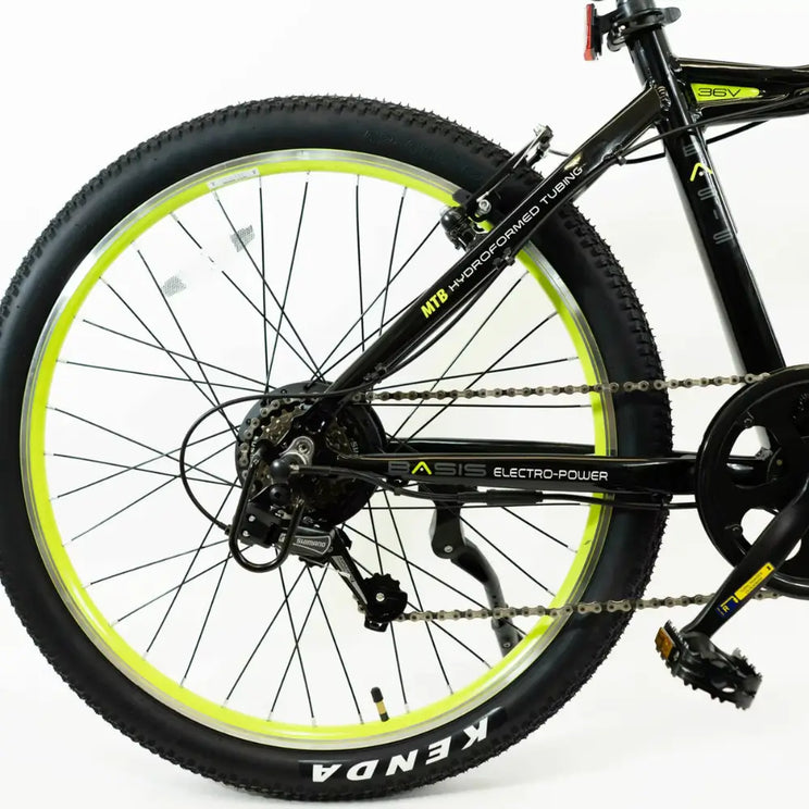 Close-up of the rear drivetrain on the Basis Hunter Unisex Electric Mountain Bike 250W showing chain, derailleur, and crankset.