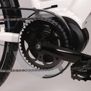Close-up of the mid-drive motor and crankset of the Batribike Penta X electric hybrid bike, showing chain guard and pedal detail.