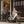 Couple holding takeaway coffees with a white Batribike Route S and a black Route X outside a cafe