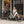 Man and woman standing with a black Batribike Route X and a white Route S outside a coffee shop