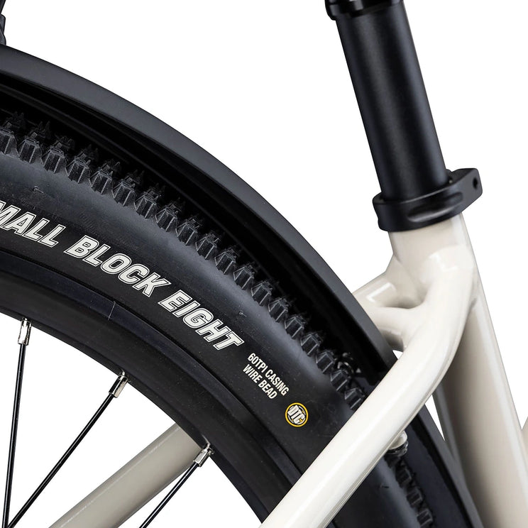 Close up of the Kenda Small Block Eight tyre and mudguard on the cream Batribike SUV S