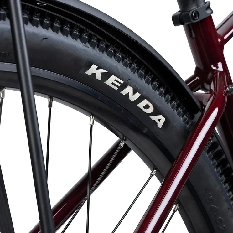 Close up of a Kenda tyre fitted beneath the black mudguard on the oxblood Batribike SUV X.