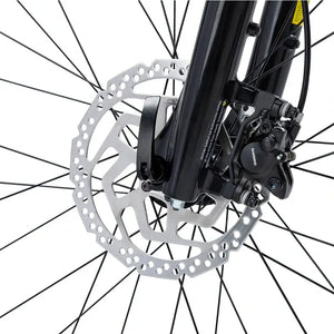 Close up of a Shimano hydraulic disc brake caliper and rotor on the Batribike Tour S front fork.