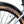 Close up of the WTB Riddler 45 tan wall tyre under the mudguard of the grey Batribike Tour X