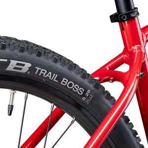 Close up of the WTB Trail Boss 29 inch tyre beside the Magma rear triangle of the Batribike Trail