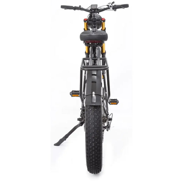Rear view of the Big Game Bikes Buffalo Alpha Plus e-bike highlighting the wide knobby tyre, rear rack, and taillight.