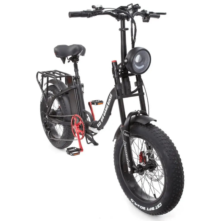Angled front view of the Big Game Bikes Impala Alpha Plus folding electric bike with large headlight and fat tyres.