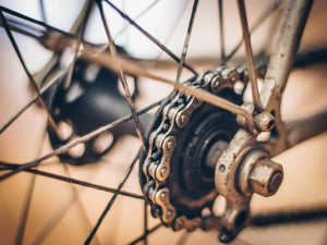 Close-up of a bicycle gear system with a blurred background