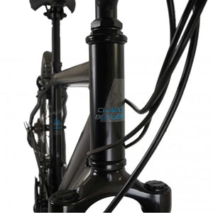 Close-up of the CLAUD BUTLER head tube logo and headset area of the Explorer 1.0 hybrid bike.